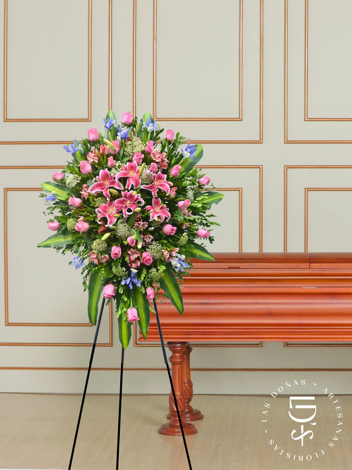 CORONA ROSAS ROSADAS, LILIUM E IRIS arreglo de condolencias con 24 rosas rosadas