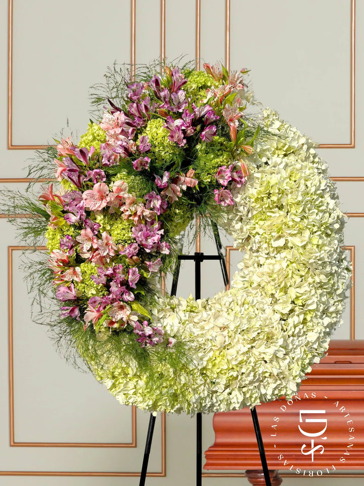 Corona Condolencias Eterno Consuelo Rosado y Lila arreglo de condolencias con Astromelias lilas y rosadas