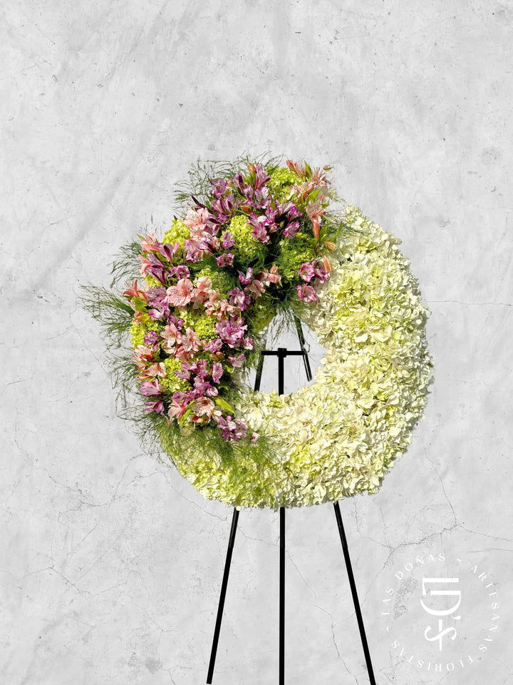 Corona Condolencias Eterno Consuelo Rosado y Lila arreglo de condolencias con Astromelias lilas y rosadas